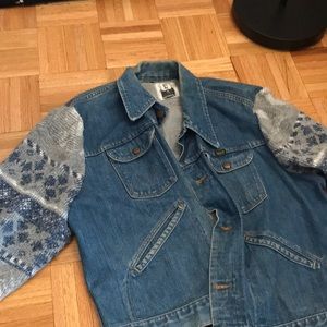 Denim jacket with knit sleeves
